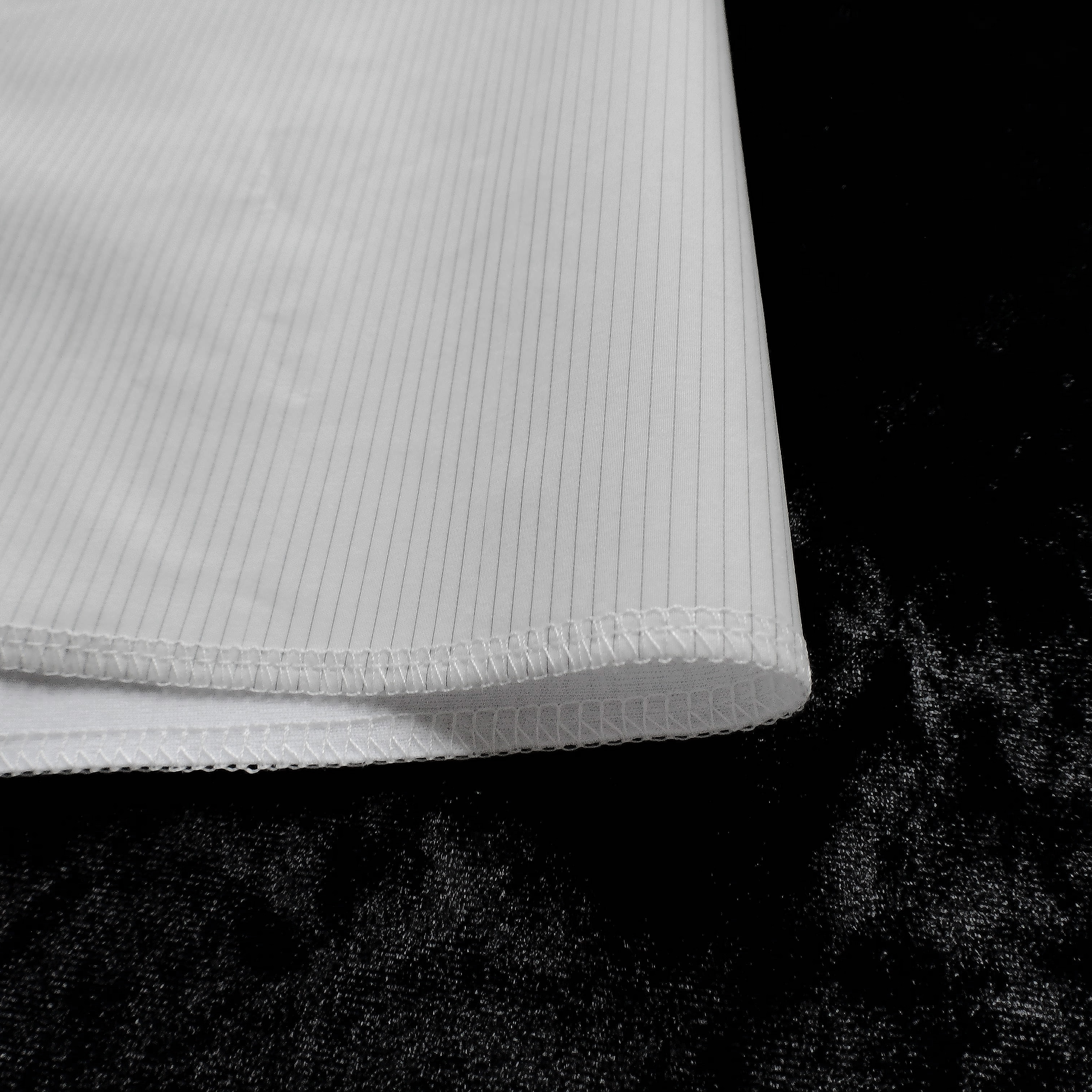 Close-up of the HexTex pinstripe weave and its clean serged medical-grade hem